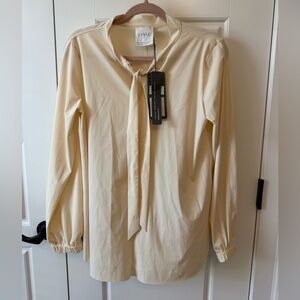 Lysse Cream Tie-Neck Long Sleeve Blouse. Tiny stain pictured.